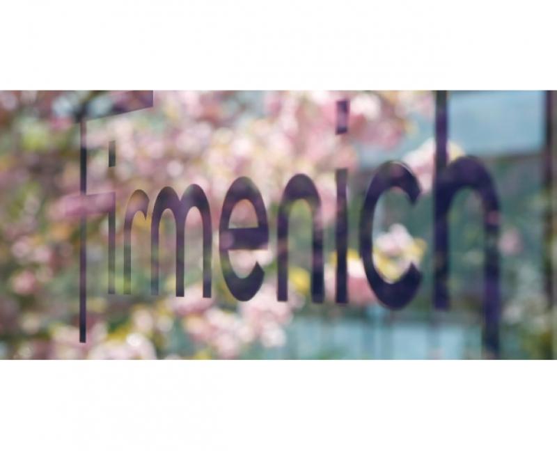 Firmenich logo on a window